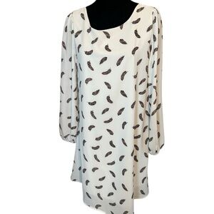 Love Kuza dress white background with red, yellow and black feathers